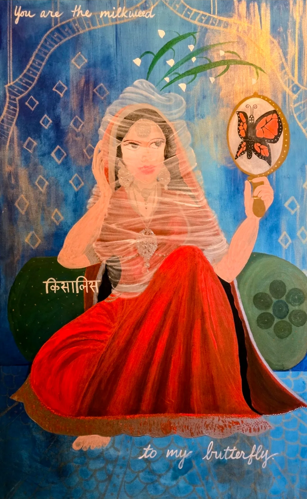 A seated woman in a sheer white veil and red skirt holds a hand mirror showing a monarch butterfly, against a blue background with painted script.