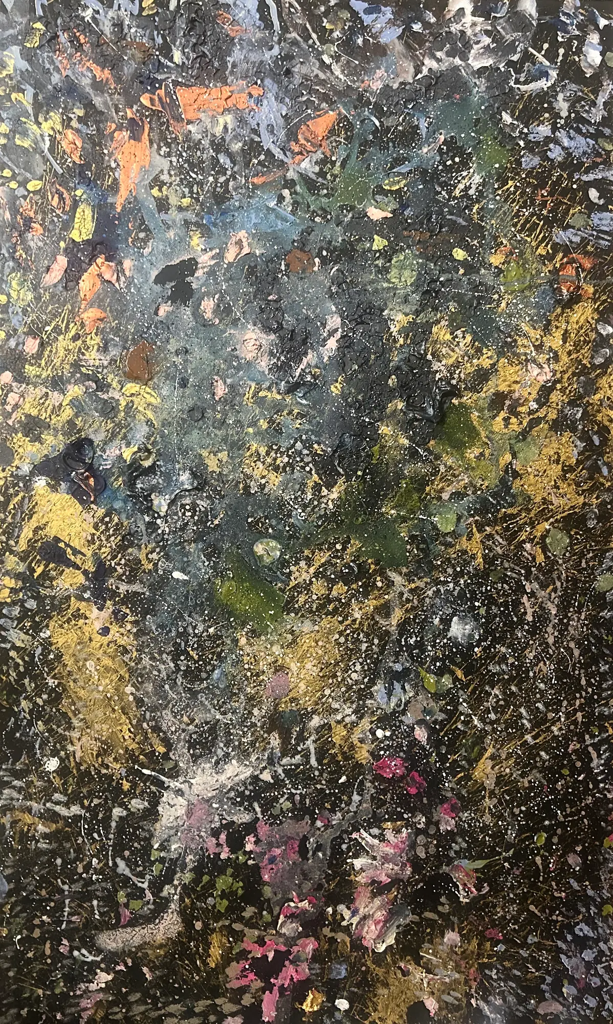 Dense abstract splatters and thick daubs of gold, gray-blue, white, pink and orange paint over a black ground, flecked with tiny white dots.