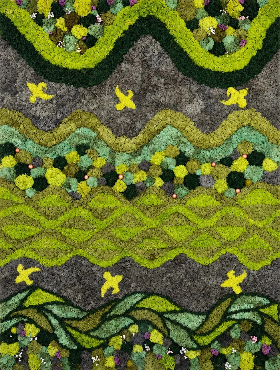 Wavy bands of preserved moss in lime, olive, mint and gray, with yellow bird shapes, small orange beads, and purple and white dried flowers.
